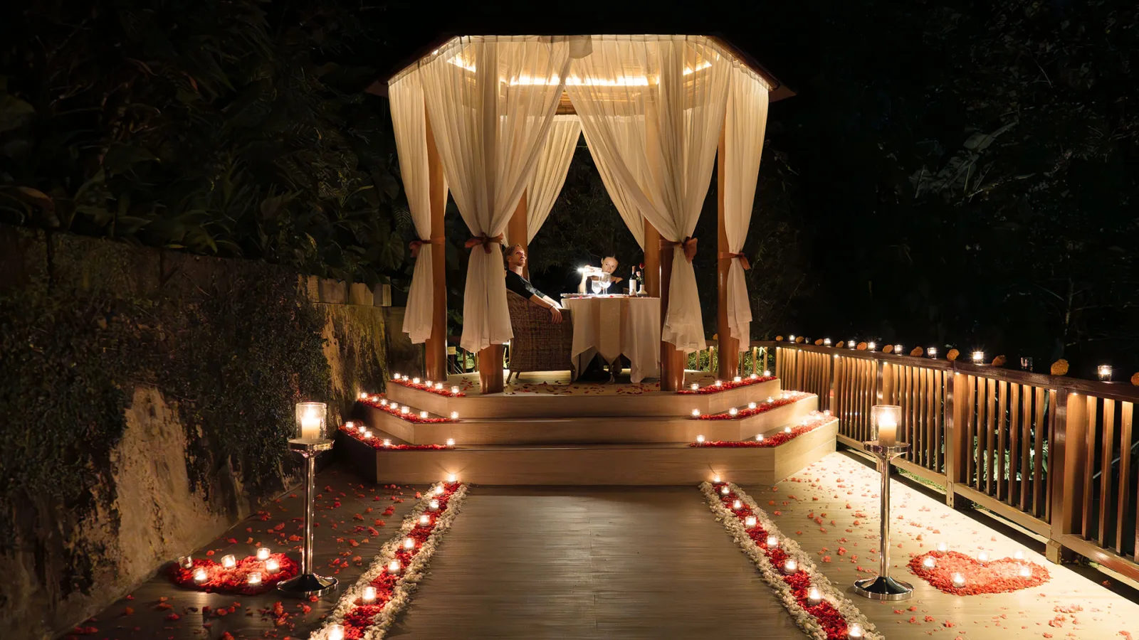 Romantic candlelit dining by the chapel at Nandini Jungle by Hanging Gardens in Bali.